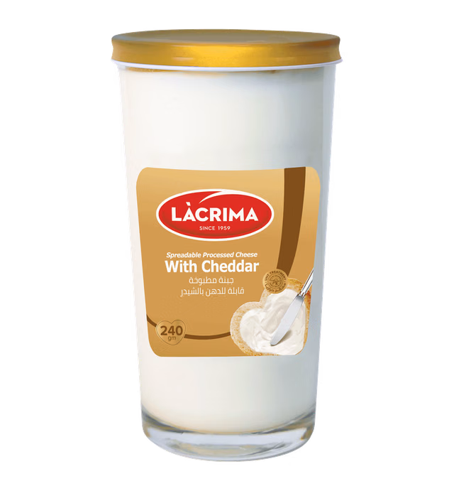 Spreadable processed cheese with cheddar flavor